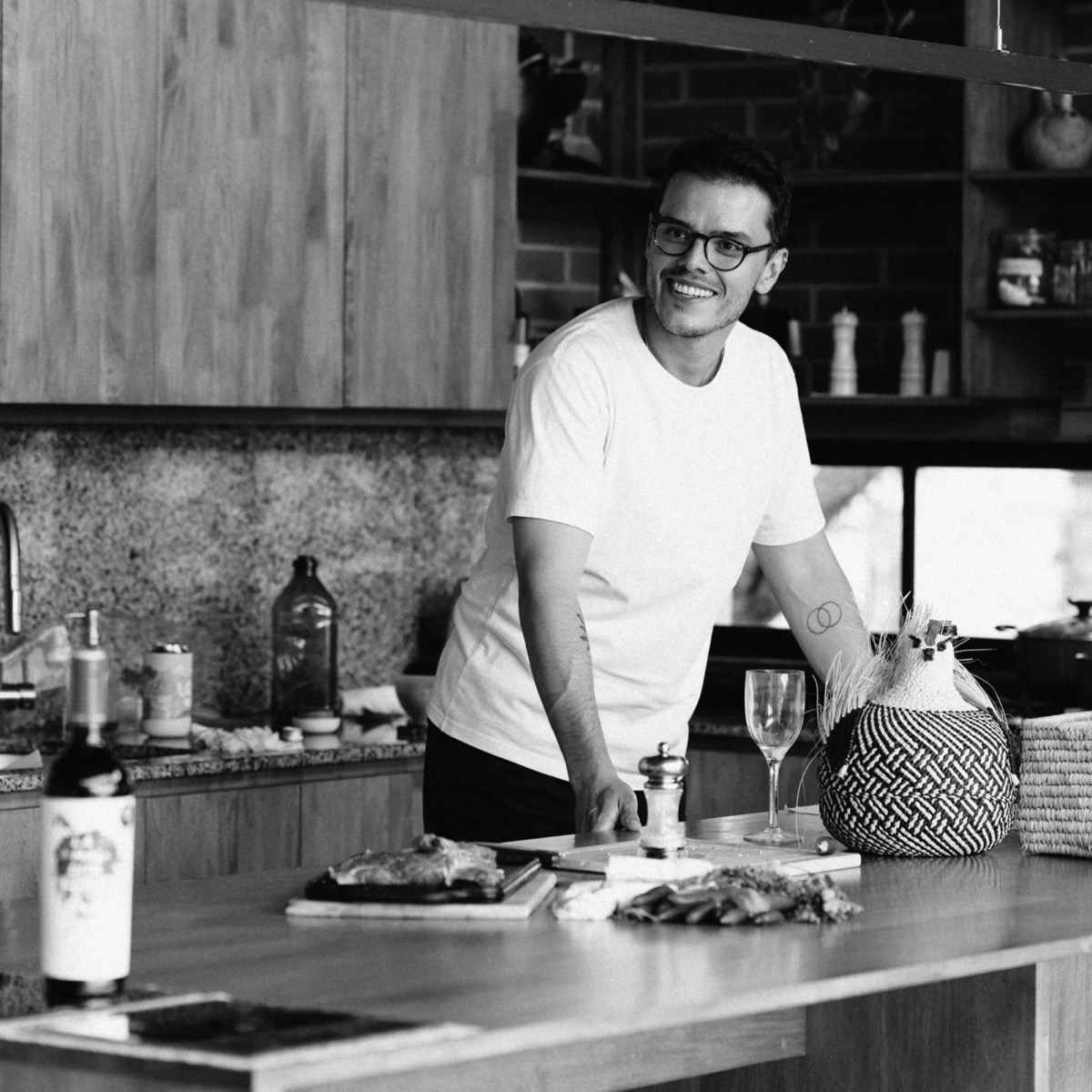 Santiago Arboleda, black and white portrait in a kitchen